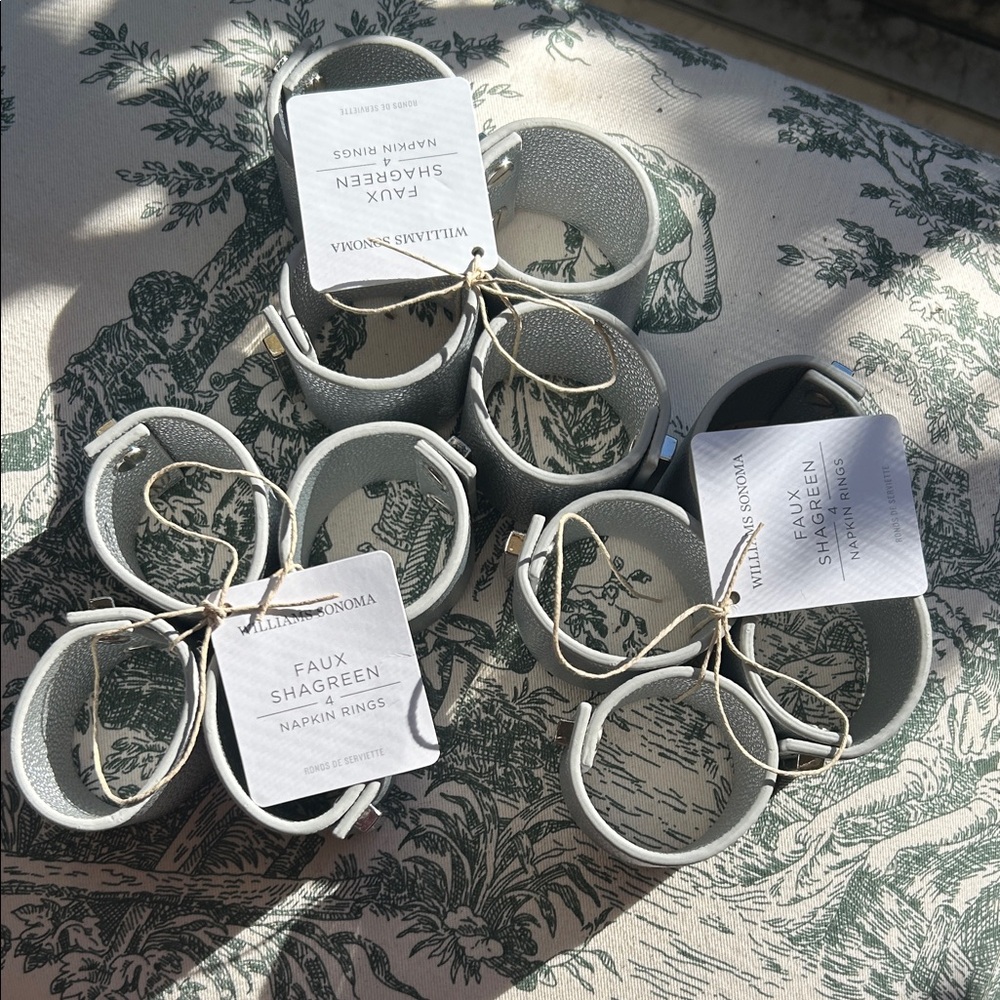 Williams Sonoma set of 12 Faux Shagreen Napkin Rings in Silver.